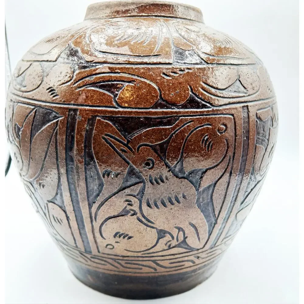 Vintage Asian Pottery Jar featuring designs of Fish, Bird, and Flowers